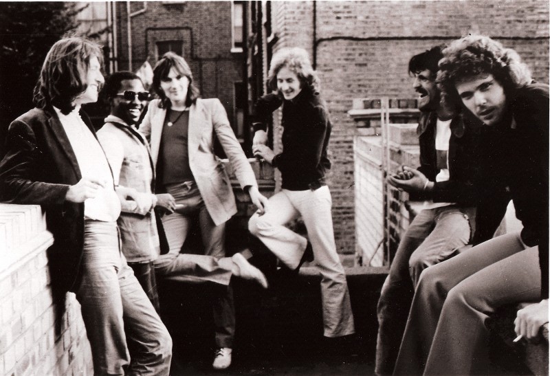 (L to R): Steve Winwood, Reebop Kwaku Baah, Chris Wood, Ric Grech, Jim Capaldi, and Unknown Person, circa 1974